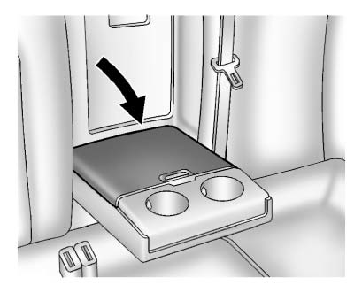 Cupholders may be located in the second row seat armrest. To access, pull the armrest down.