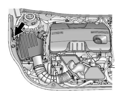 The electrical cord is located on the passenger side of the engine compartment, between the fender and the air cleaner.