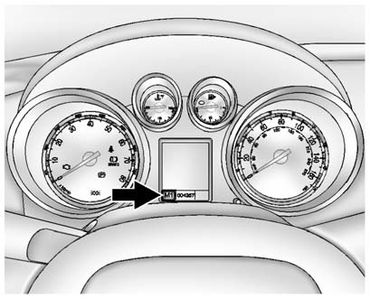 2. Press the shift lever forward (+) to upshift or rearward (−) to downshift.