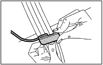 2. Place the guide over the belt, and insert the two