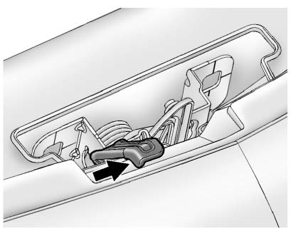 2. Go to the front of the vehicle and move the secondary hood release handle to the right.