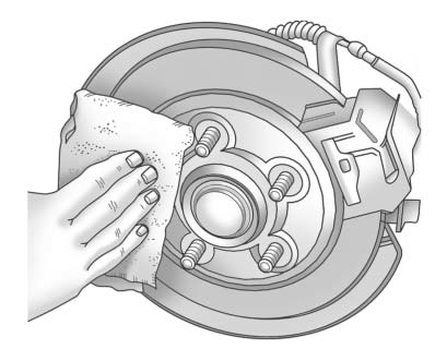 13. Remove any rust or dirt from the wheel bolts, mounting surfaces, and spare wheel.