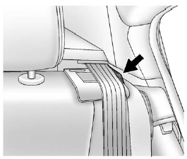 2. Make sure the safety belt is in the guide on top of the seatback.