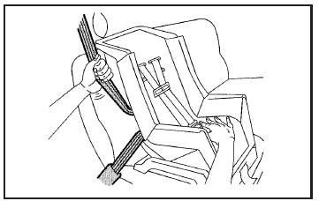 6. To tighten the belt, push down on the child