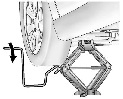 10. Raise the vehicle by turning the jack handle clockwise. Raise the vehicle far enough off the ground so there is enough room for the road tire to clear the ground.